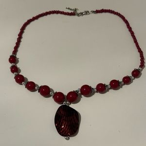 Red Beaded Silver Tone Clasp Necklace with Large Red Stone Pendant